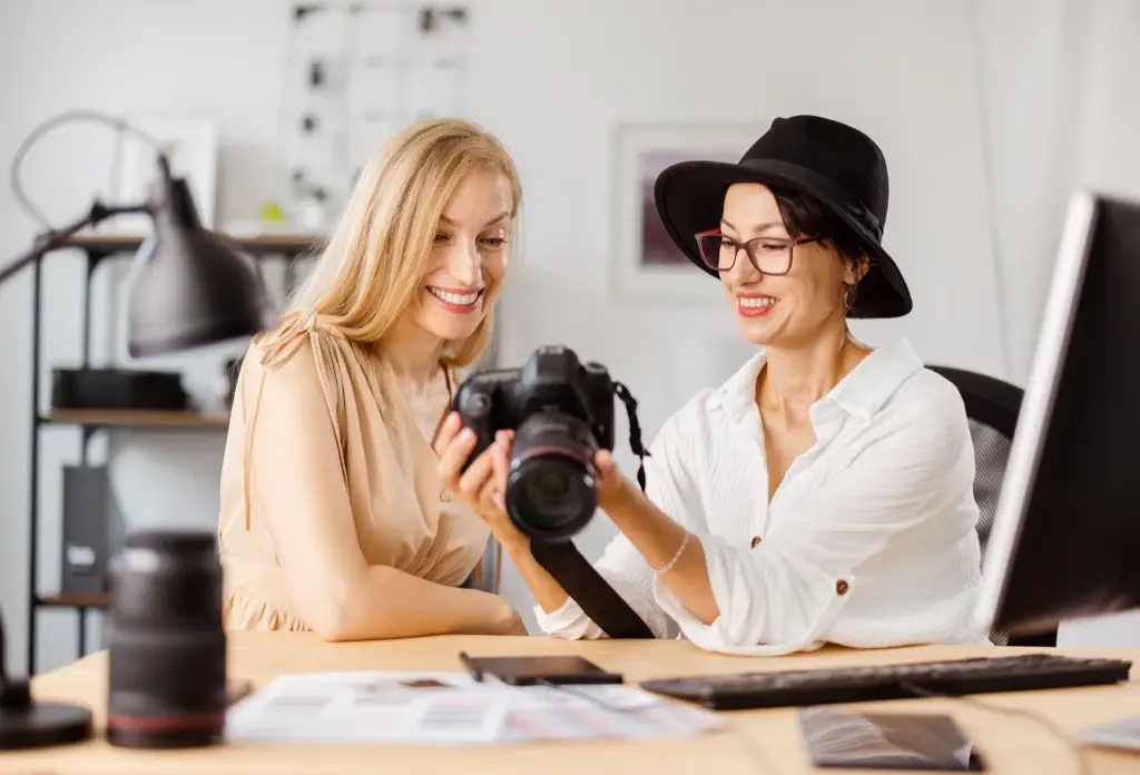 Photographers browsing camera